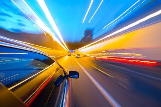 Long exposure of car driving down highway